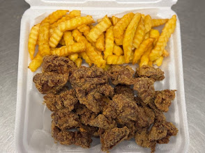 Fresh fried chicken gizzards served with crinkle-cut fries